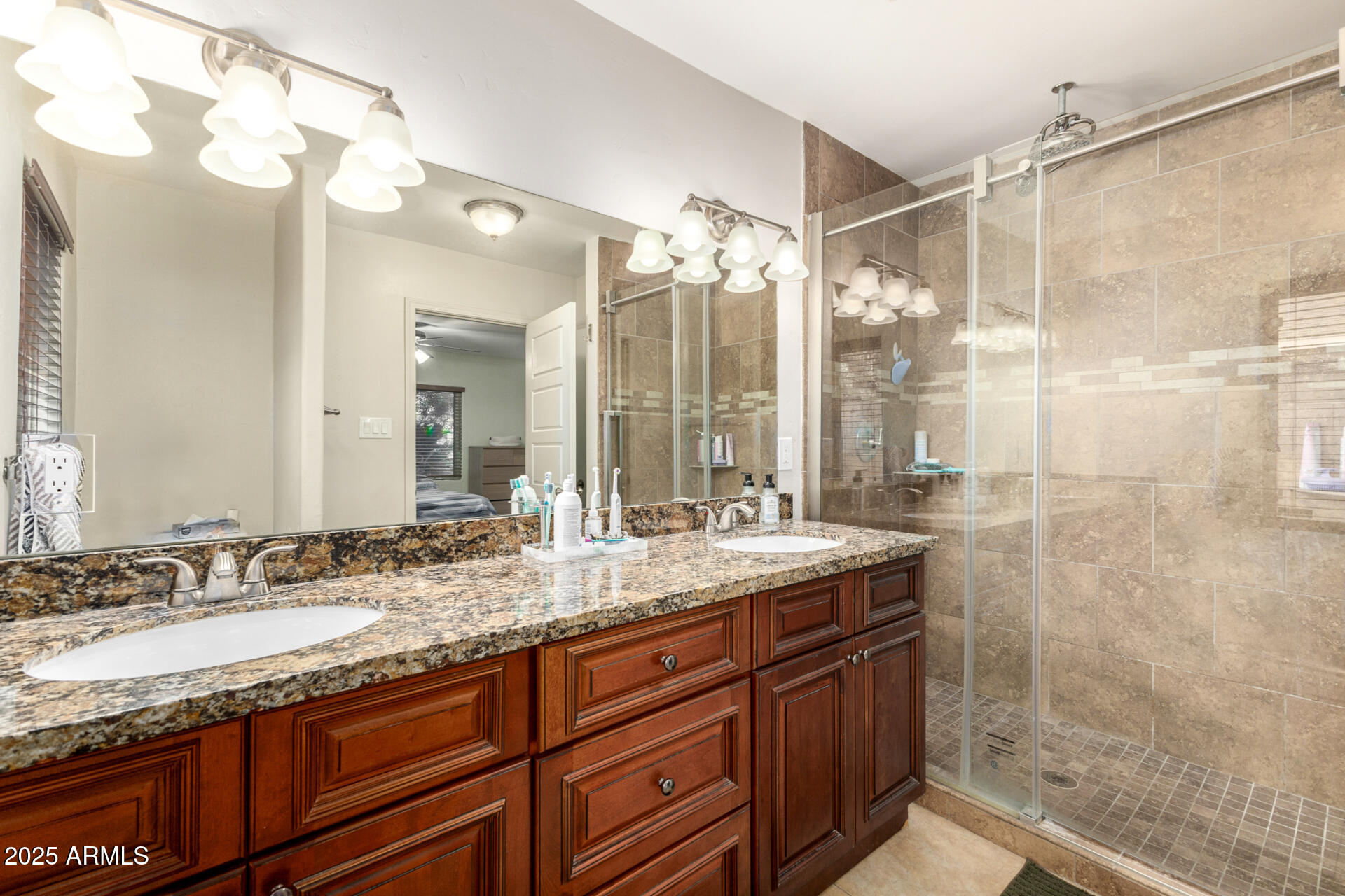 6842 North 10th Place Phoenix, AZ 85014 - Photo 25 of 60 a bathroom with a granite countertop sink mirror and double