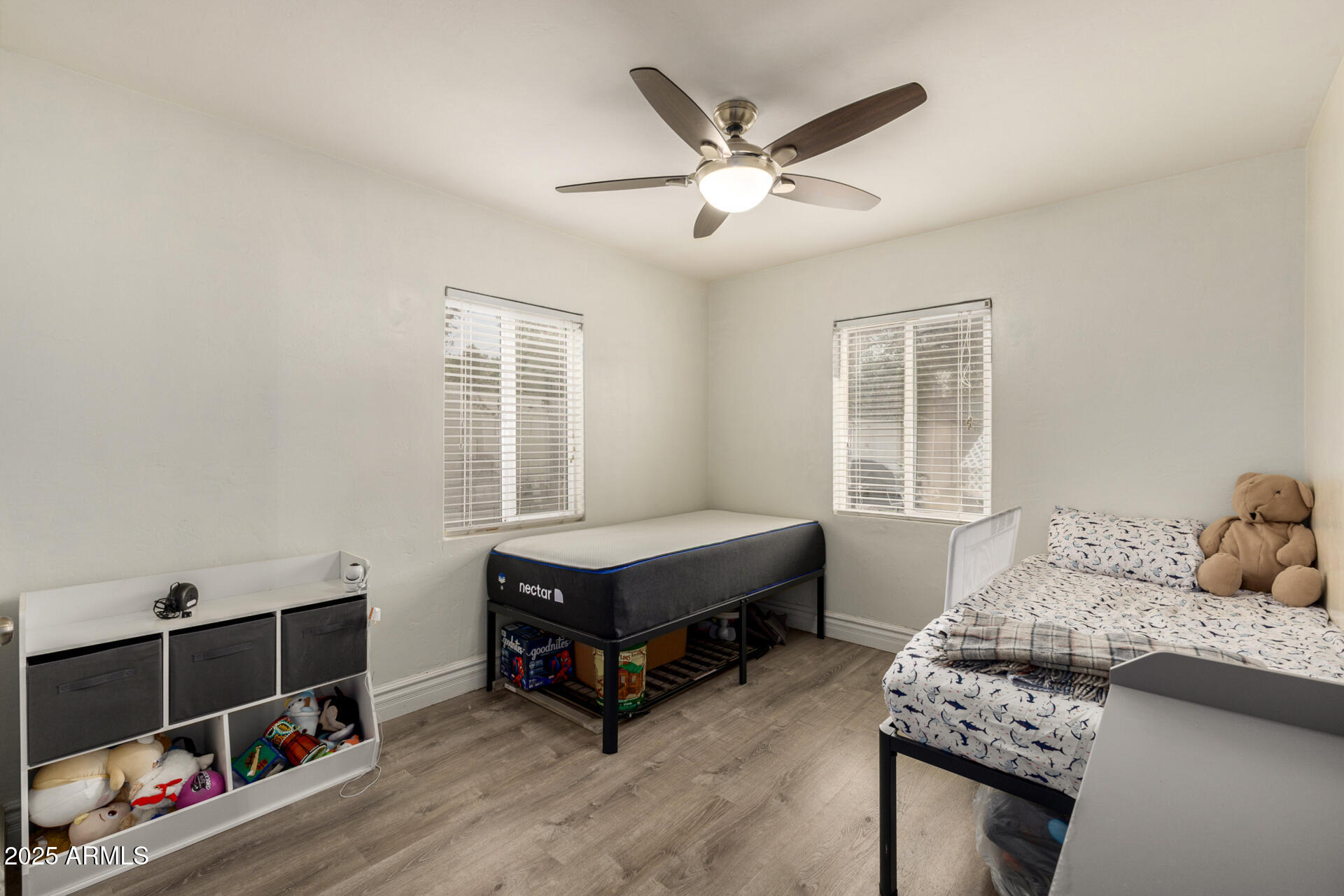 6842 North 10th Place Phoenix, AZ 85014 - Photo 25 of 60 a bedroom with furniture and a window