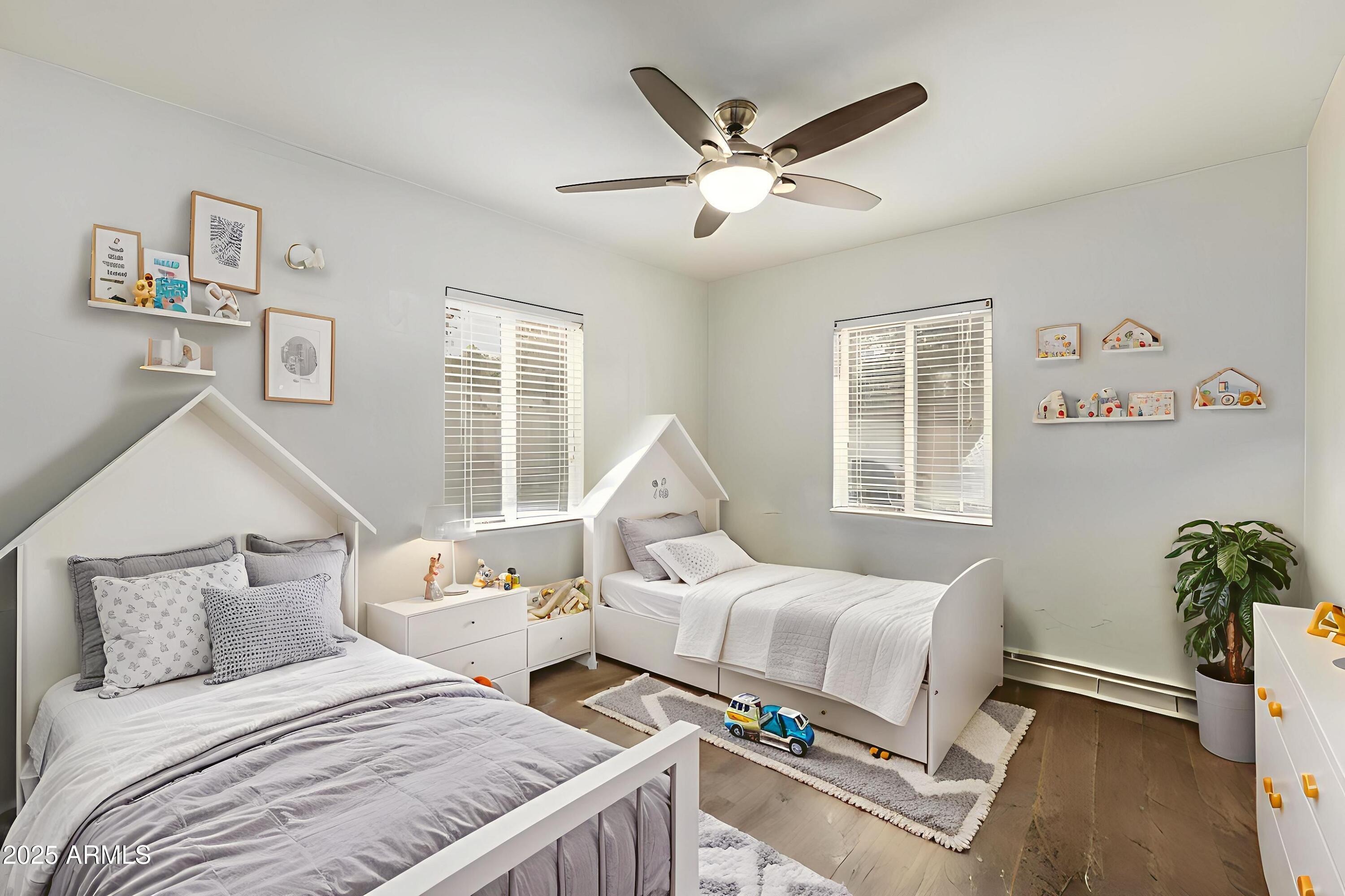 6842 North 10th Place Phoenix, AZ 85014 - Photo 29 of 60 a bedroom with a bed and a window