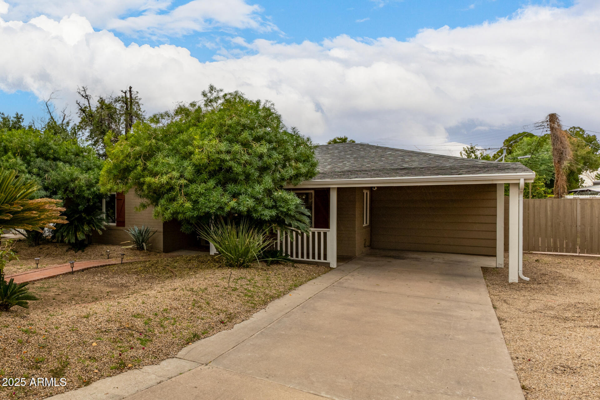 6842 North 10th Place Phoenix, AZ 85014 - Photo 46 of 60 a front view of a house with a yard and garage