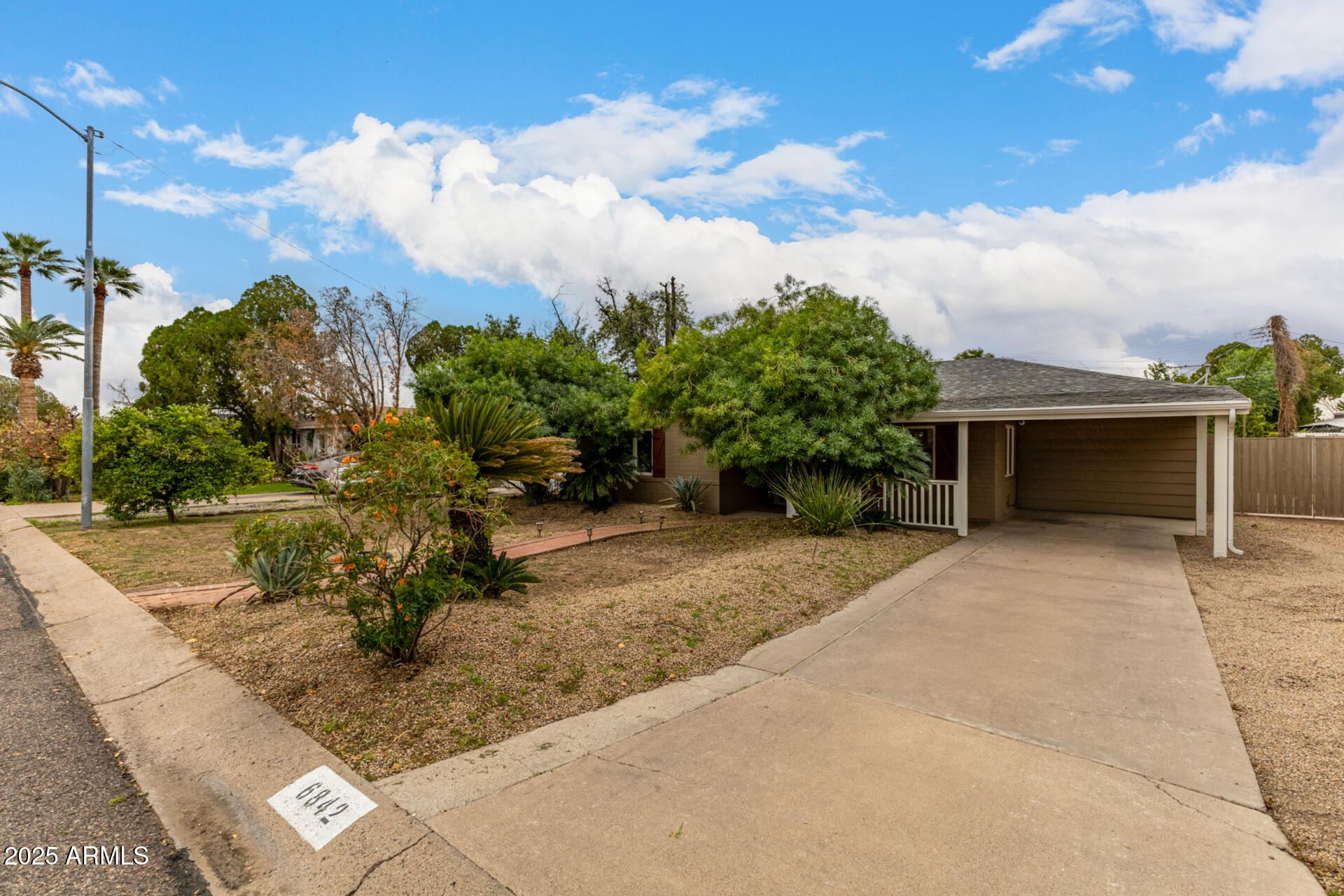 6842 North 10th Place Phoenix, AZ 85014 - Photo 47 of 60 a front view of a house with a yard and garage