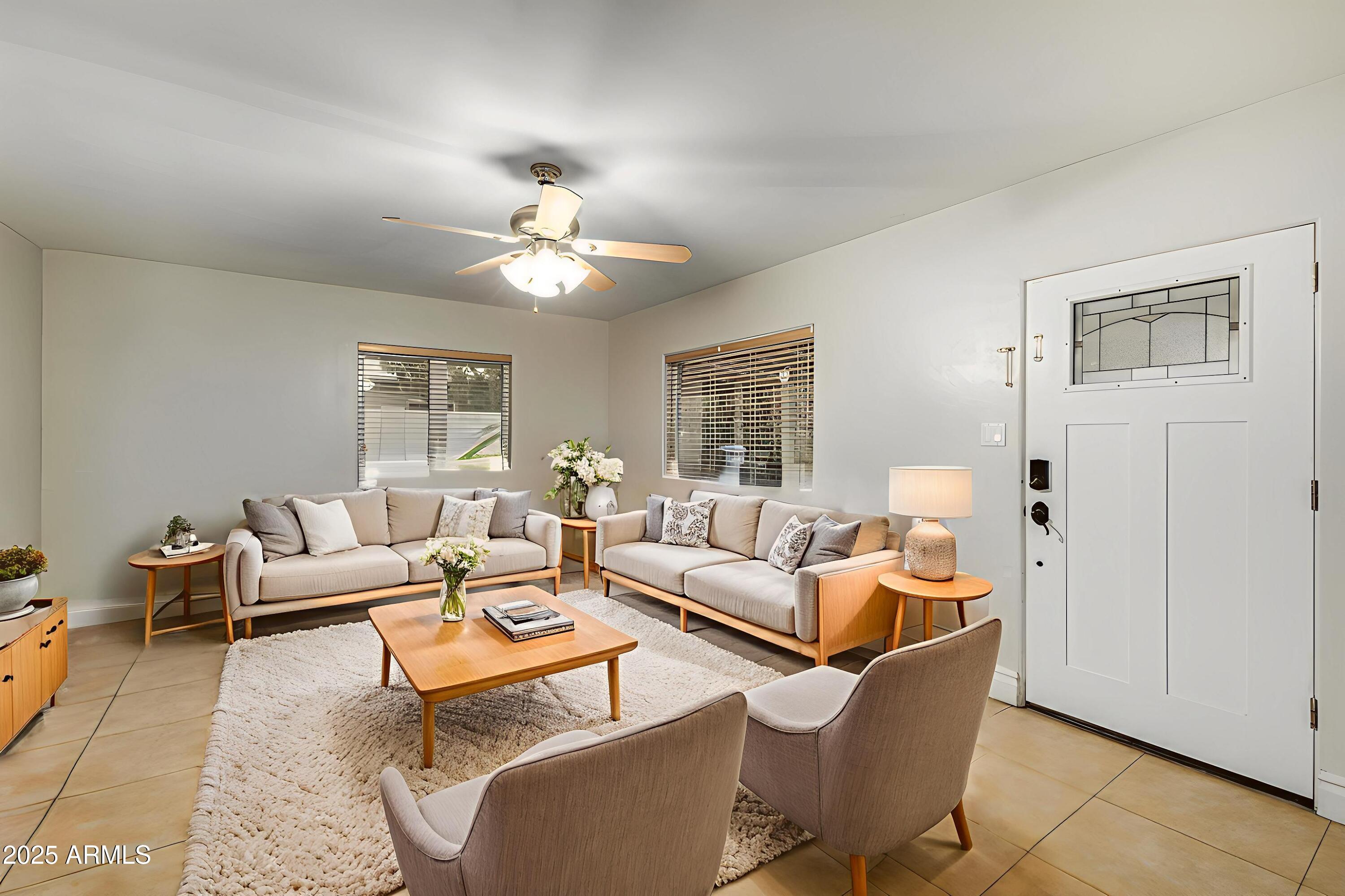 6842 North 10th Place Phoenix, AZ 85014 - Photo 7 of 60 a living room with furniture potted plant and a window