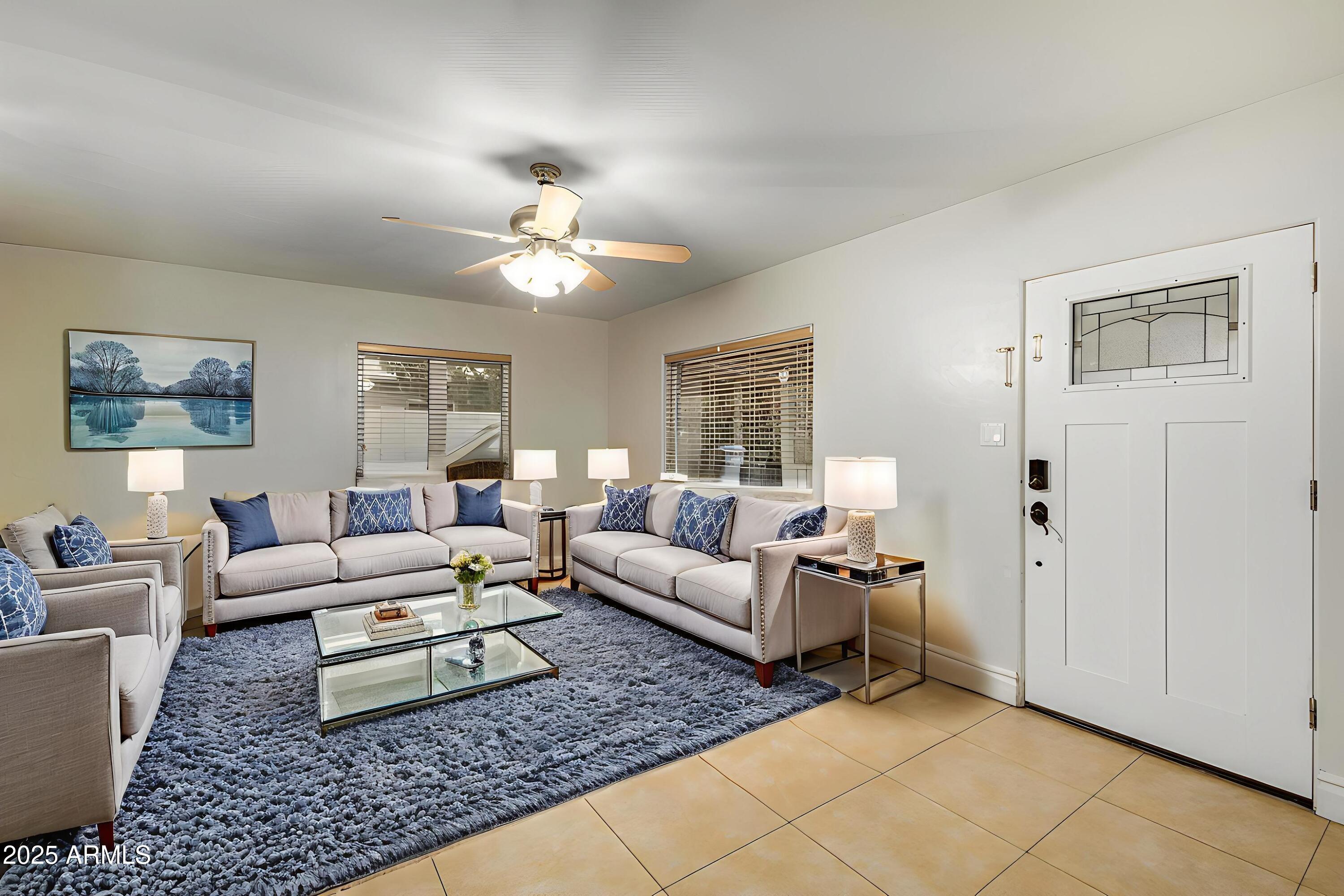 6842 North 10th Place Phoenix, AZ 85014 - Photo 8 of 60 a living room with furniture and wooden floor