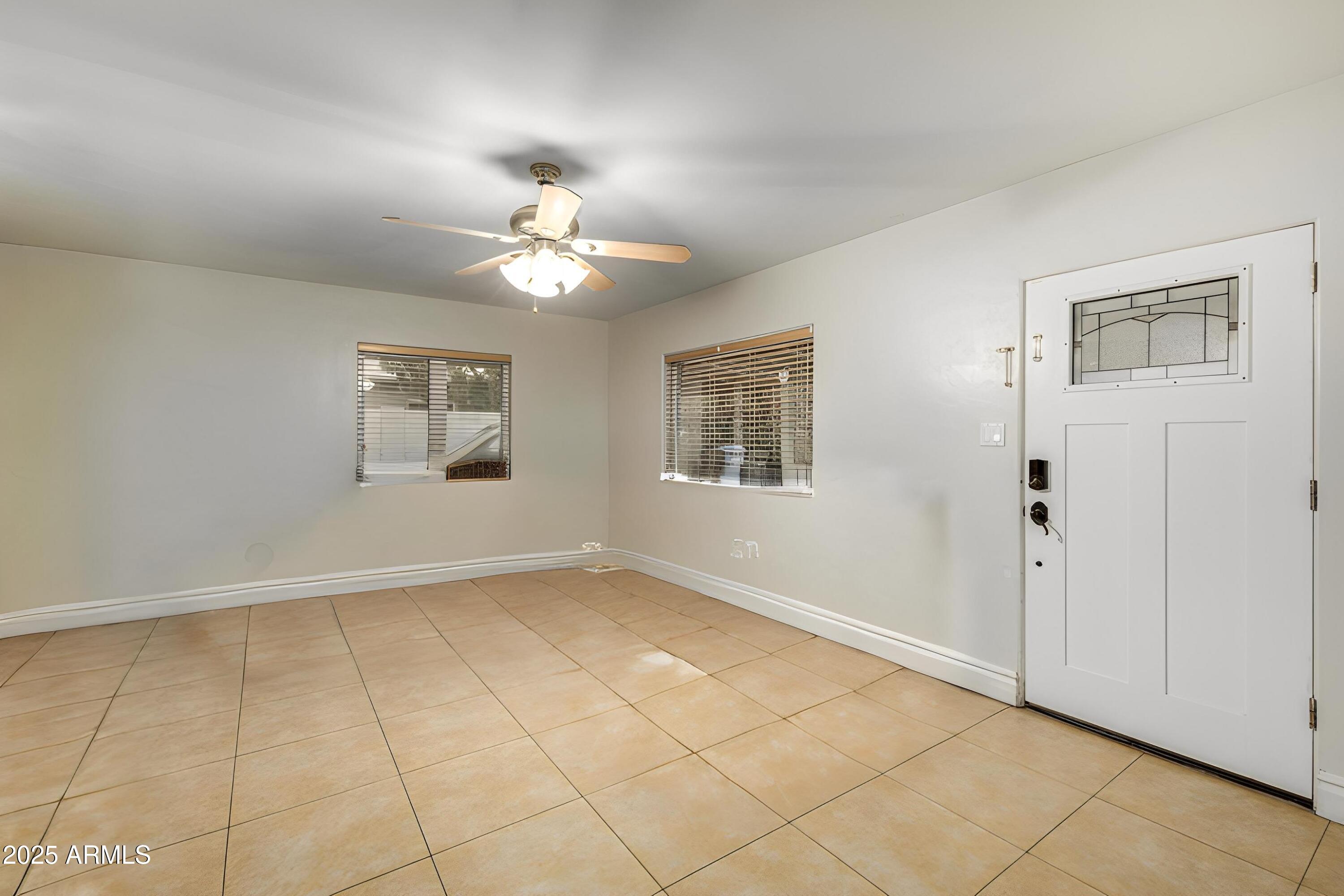 6842 North 10th Place Phoenix, AZ 85014 - Photo 8 of 60 a view of an empty room with a window