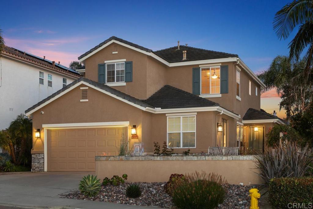 1190 Mariposa Road Carlsbad, CA 92011 - Photo 1 of 1 a front view of a house with a yard