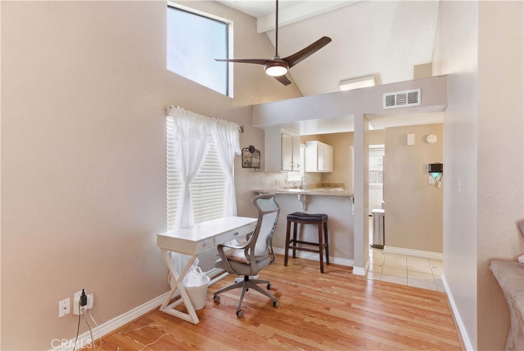 7800 Westfield Road, Unit 28 Bakersfield, CA 93309 - Photo 5 of 16 a view of a a dining room with furniture window and wooden floor
