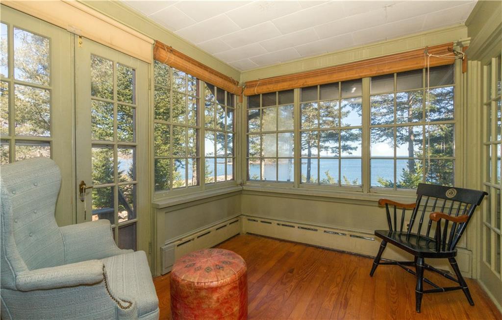 52 Ginn Point Road Owls Head, ME 04854 - Photo 9 of 32 A cozt sunroom.