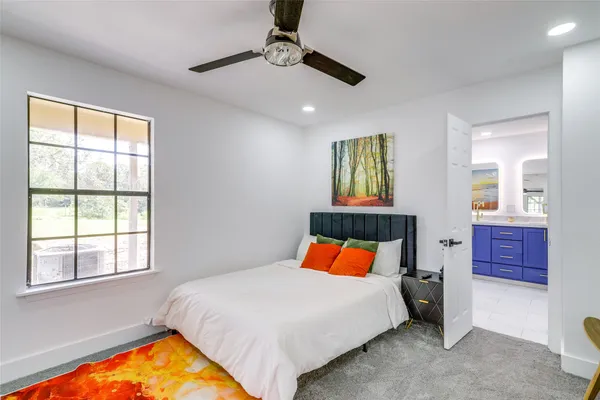 a bedroom with a bed and window