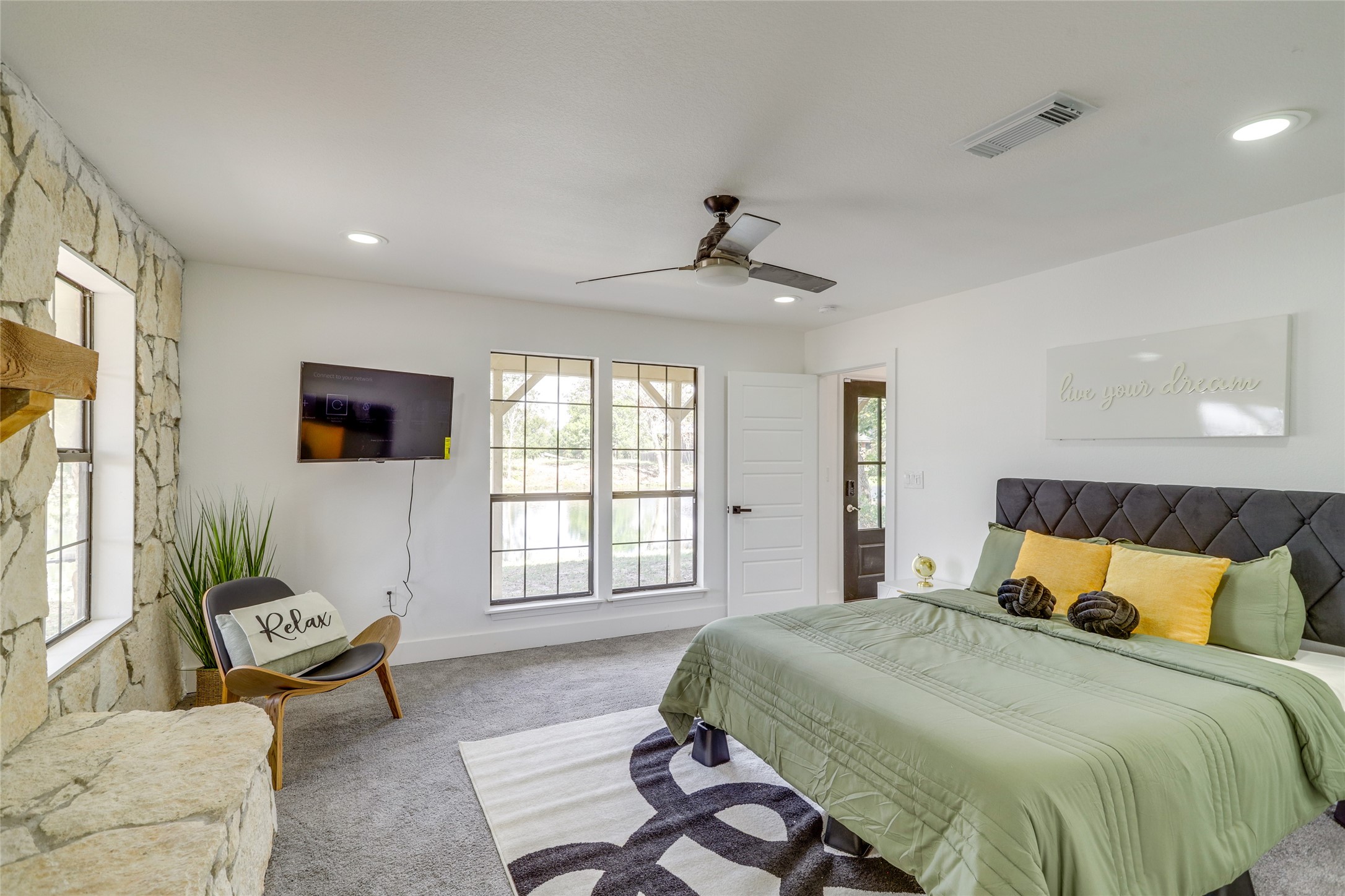 13302 Farm To Market 359, Unit A Hempstead, TX 77445 - Photo 21 of 28 a bedroom with a bed and a couch