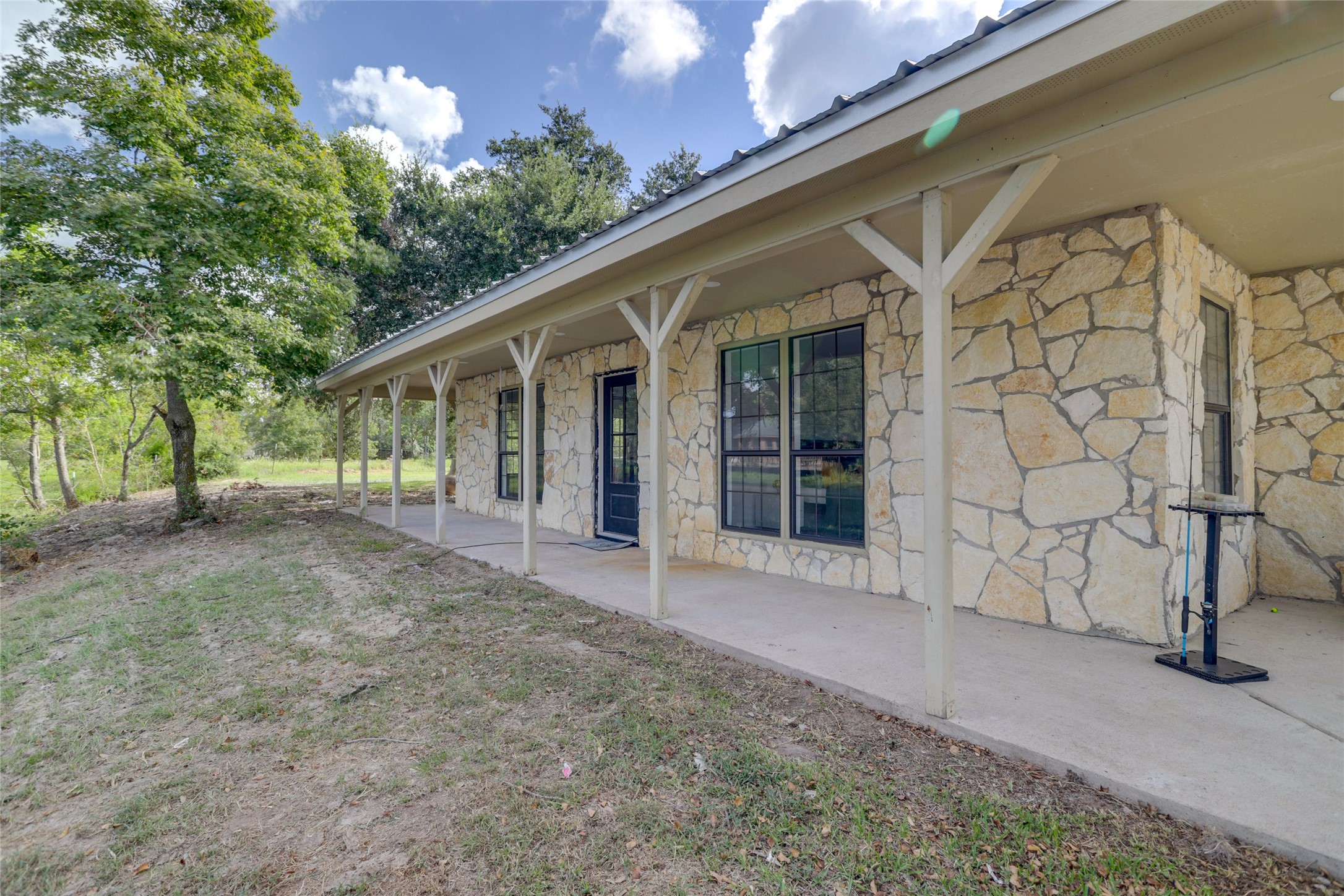 13302 Farm To Market 359, Unit A Hempstead, TX 77445 - Photo 28 of 28 a view of a house with a yard and potted plants