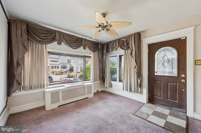 a view of a hallway with a chandelier