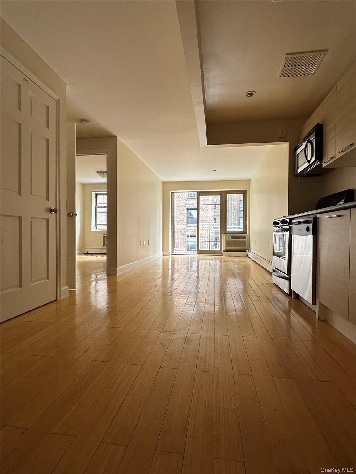 a view of a livingroom with wooden floor