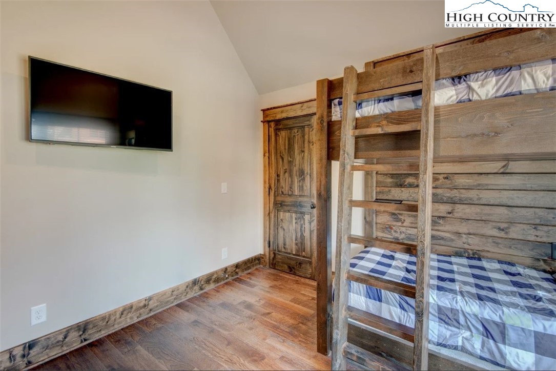 273 High Country Overlook Banner Elk, NC 28604 - Photo 16 of 50 a view of a livingroom with wooden floor and staircase