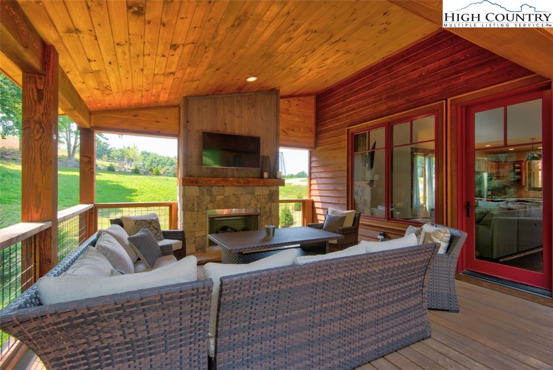 273 High Country Overlook Banner Elk, NC 28604 - Photo 18 of 50 a living room with fireplace furniture and a large window