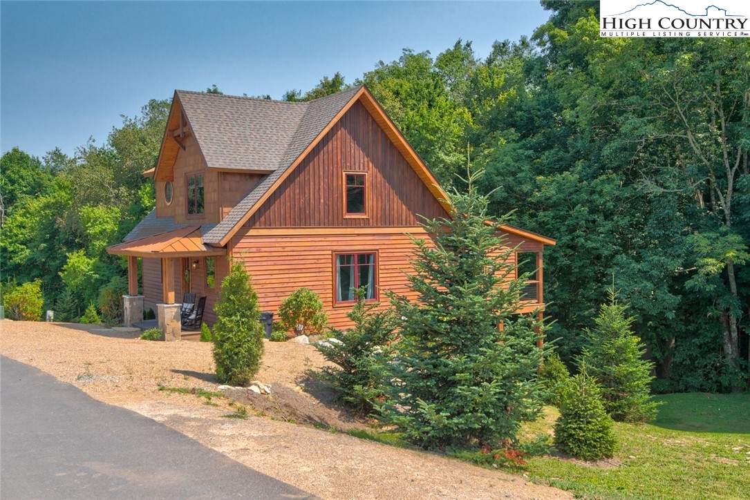 273 High Country Overlook Banner Elk, NC 28604 - Photo 20 of 50 a front view of a house with a yard