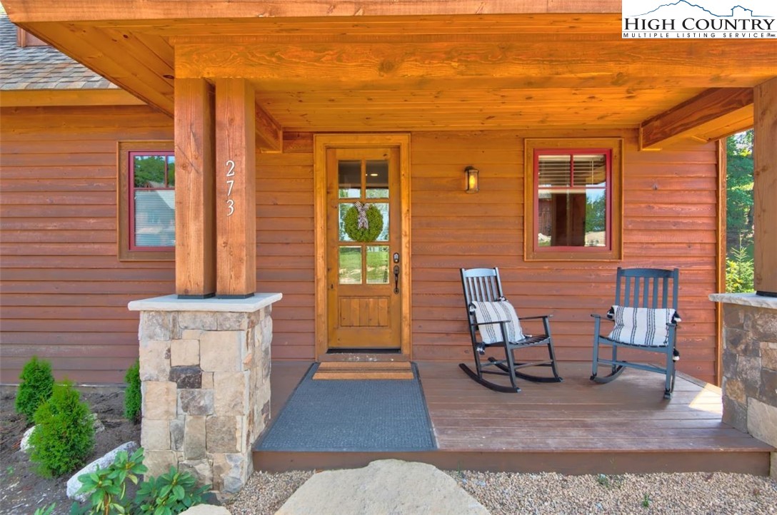 273 High Country Overlook Banner Elk, NC 28604 - Photo 2 of 50 a front view of a house with outdoor seating