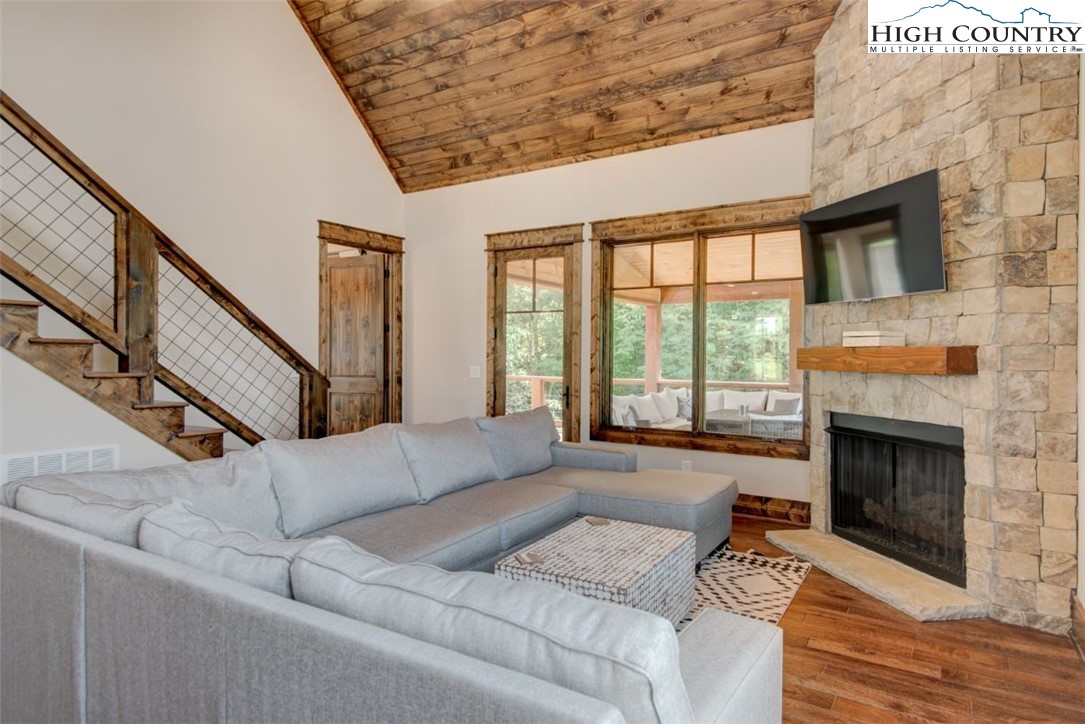 273 High Country Overlook Banner Elk, NC 28604 - Photo 3 of 50 a living room with furniture large window and a fireplace
