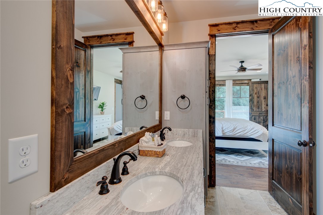 273 High Country Overlook Banner Elk, NC 28604 - Photo 31 of 50 a bathroom with a sink and a mirror