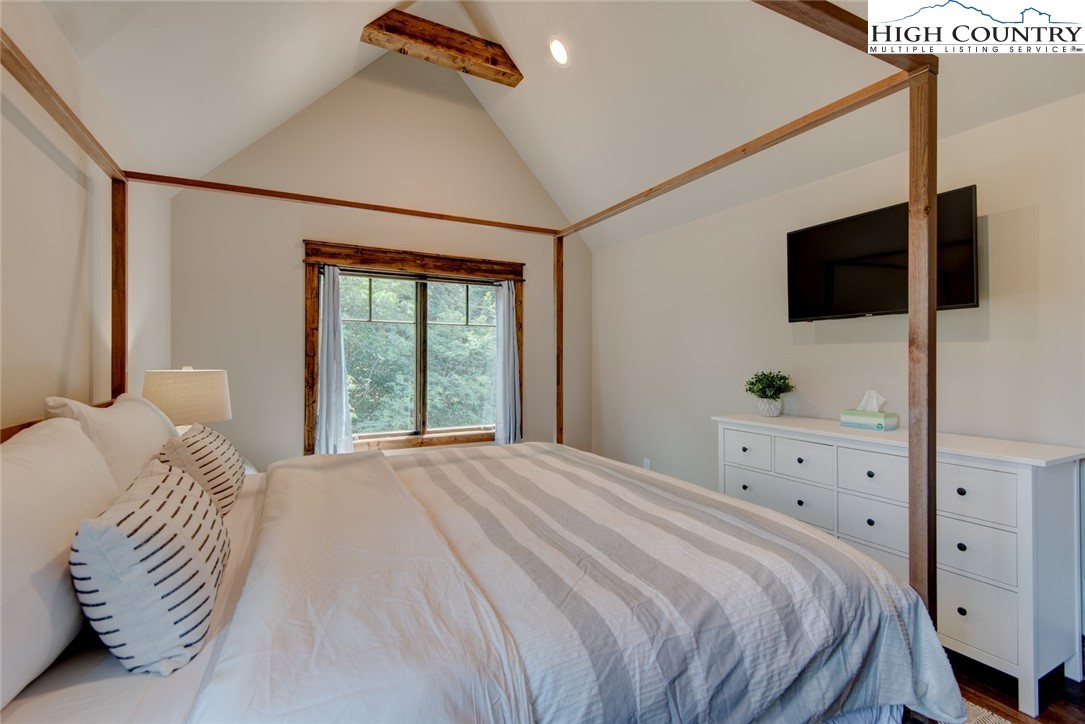 273 High Country Overlook Banner Elk, NC 28604 - Photo 34 of 50 a bedroom with a bed and a flat screen tv