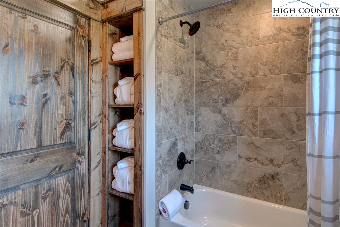 273 High Country Overlook Banner Elk, NC 28604 - Photo 36 of 50 a bathroom with a tub and shower