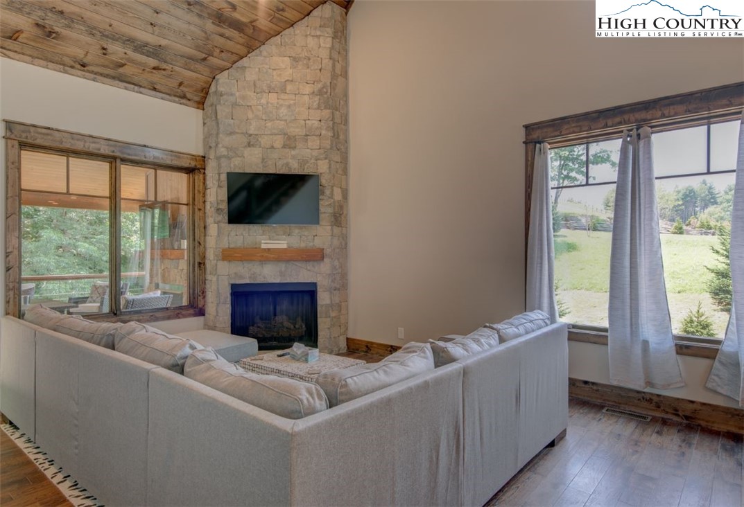 273 High Country Overlook Banner Elk, NC 28604 - Photo 4 of 50 a living room with furniture a fireplace and a flat screen tv