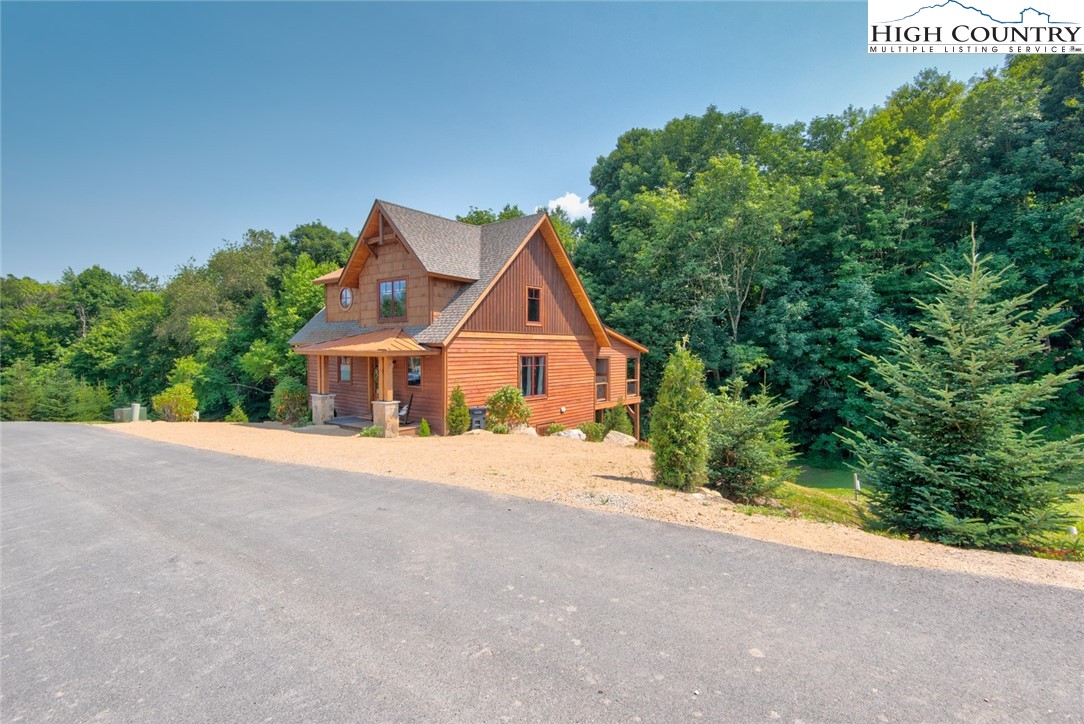 273 High Country Overlook Banner Elk, NC 28604 - Photo 44 of 50 a front view of a house with a yard and garage