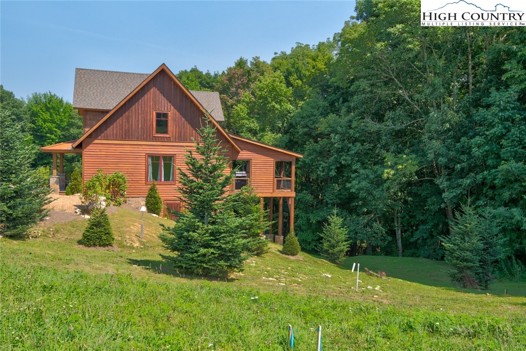 273 High Country Overlook Banner Elk, NC 28604 - Photo 45 of 50 a front view of a house with yard and green space