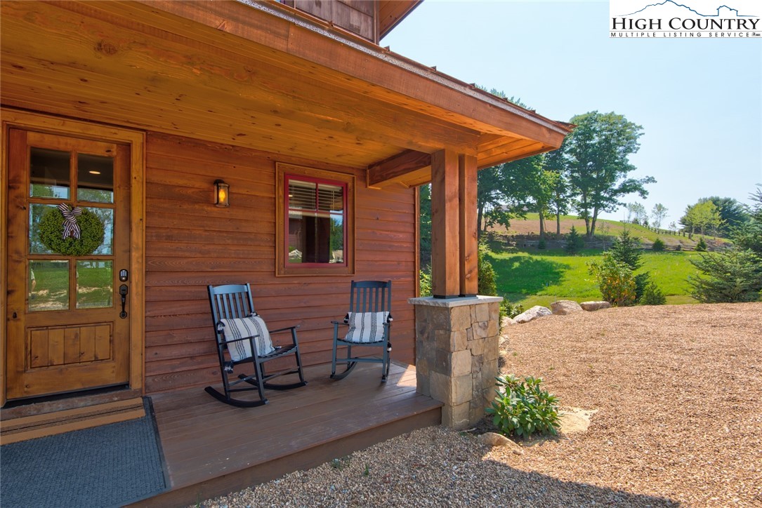 273 High Country Overlook Banner Elk, NC 28604 - Photo 46 of 50 a patio with table and chairs and potted plants