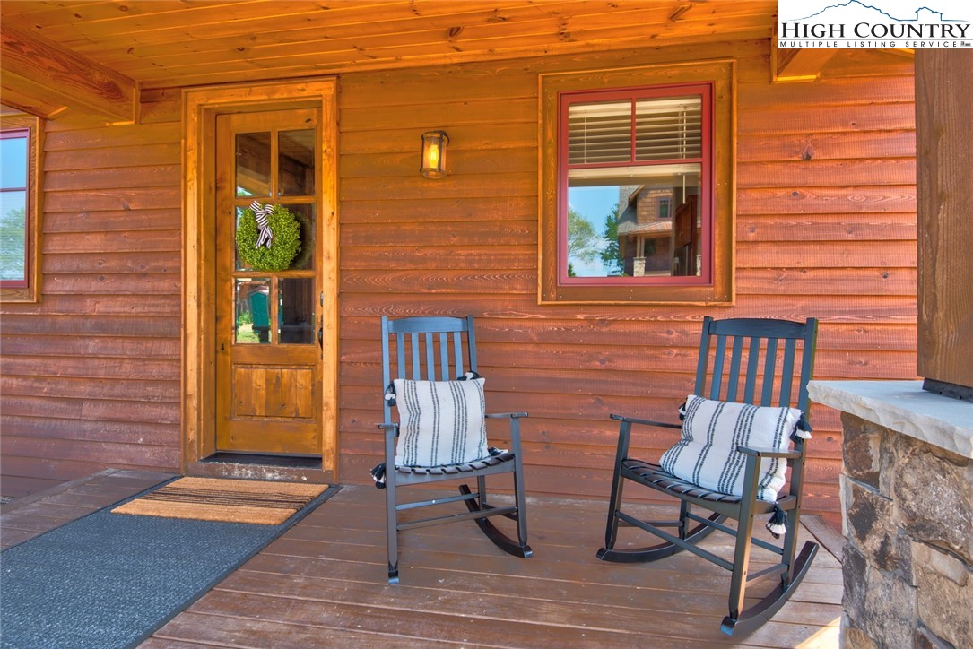 273 High Country Overlook Banner Elk, NC 28604 - Photo 47 of 50 a front view of a house with a chairs and table