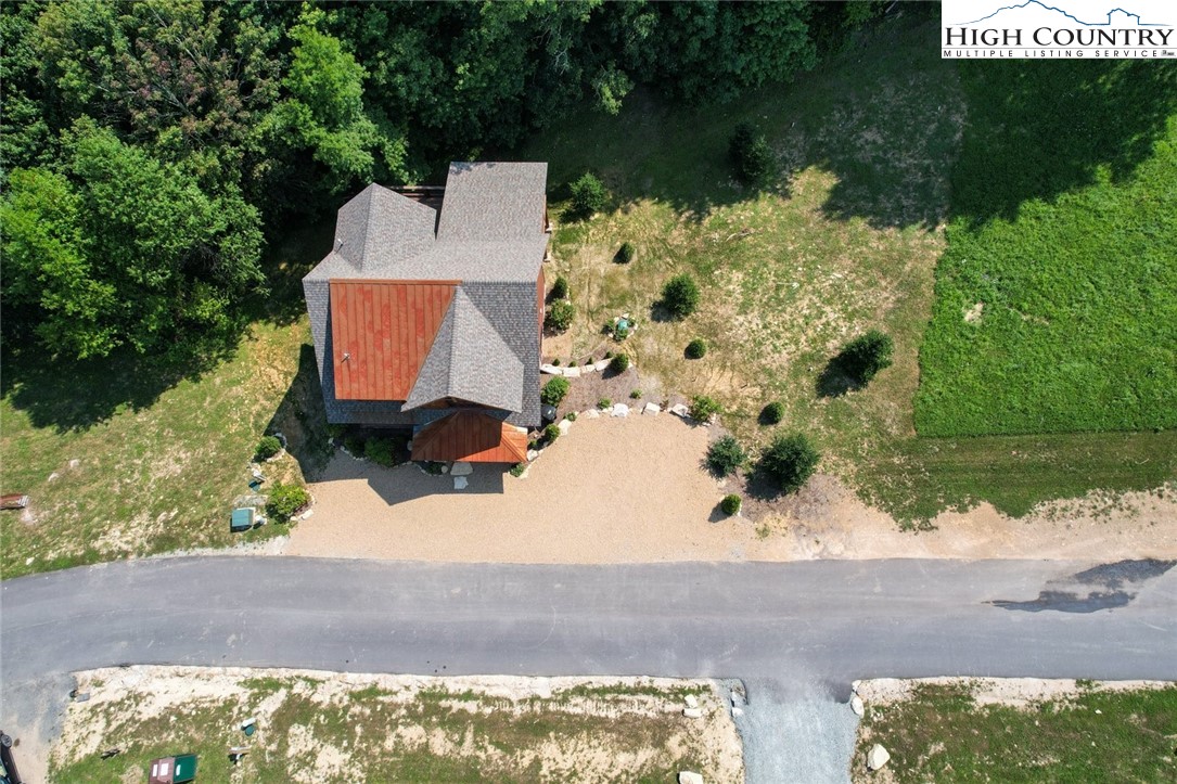 273 High Country Overlook Banner Elk, NC 28604 - Photo 50 of 50 an aerial view of a house with a yard and lake view