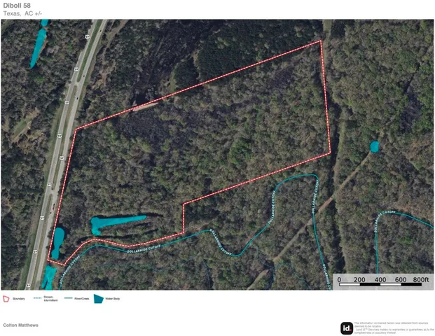 a black and white photo of a green field