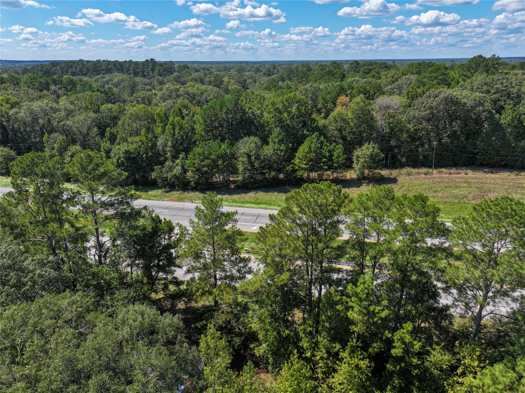 0 Us-59 Diboll, TX 75941 - Photo 12 of 33 a view of a lake with a building in the background