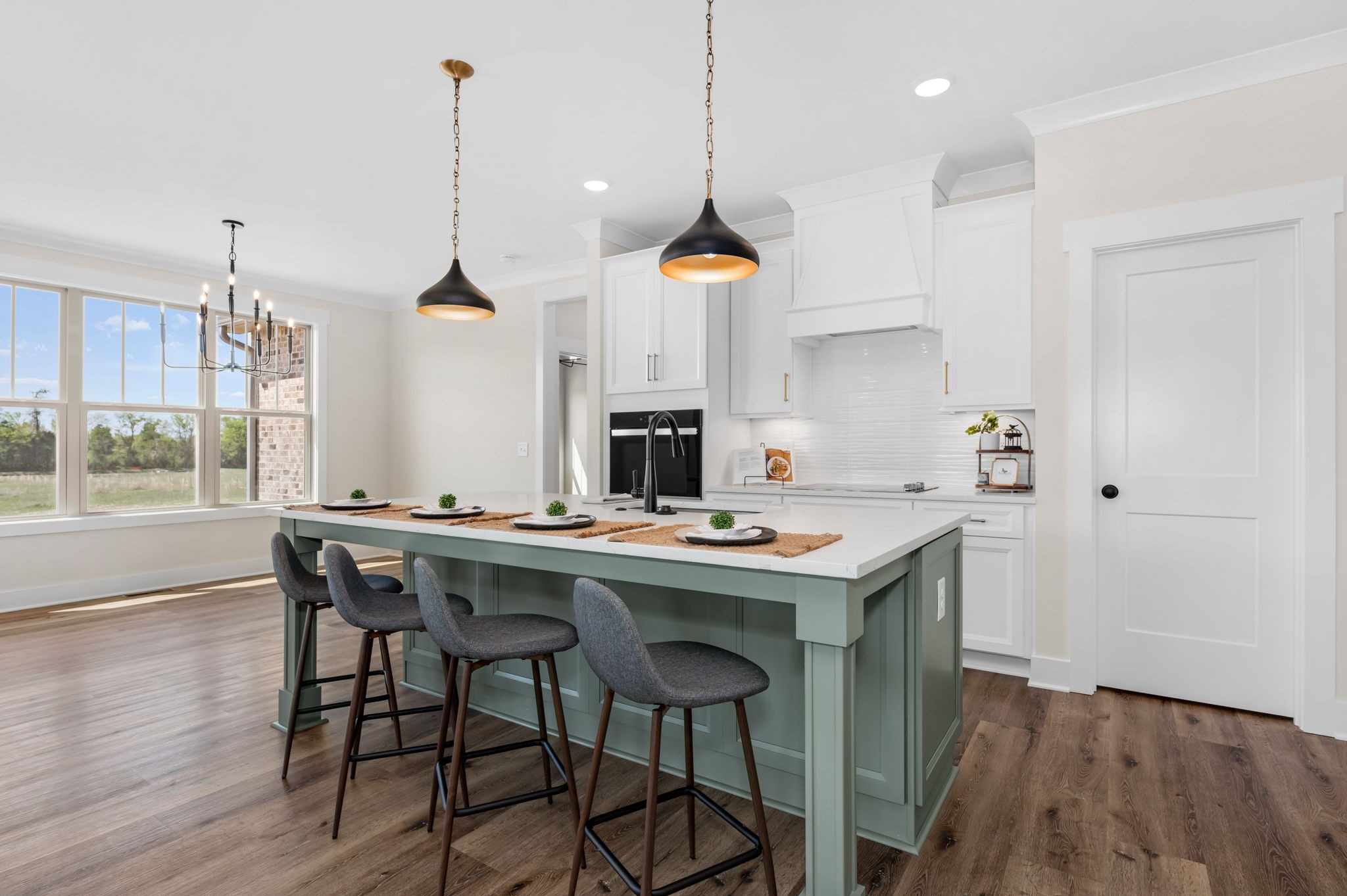7254 West Gum Road Murfreesboro, TN 37127 - Photo 15 of 58 a view of a kitchen area with furniture and wooden floor