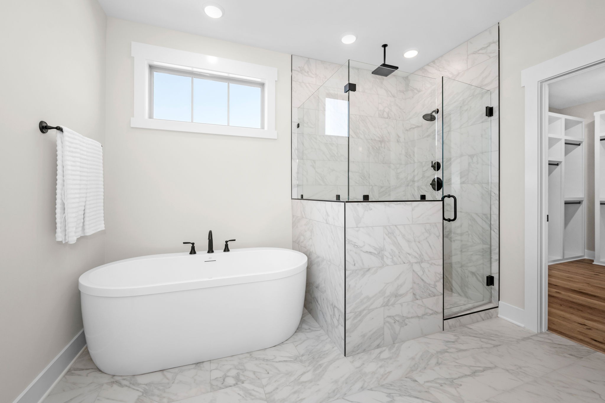 7254 West Gum Road Murfreesboro, TN 37127 - Photo 26 of 58 a white bath tub sitting next to a bathroom