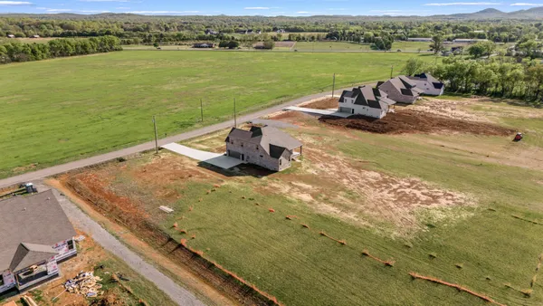 an aerial view of a house with a lake view