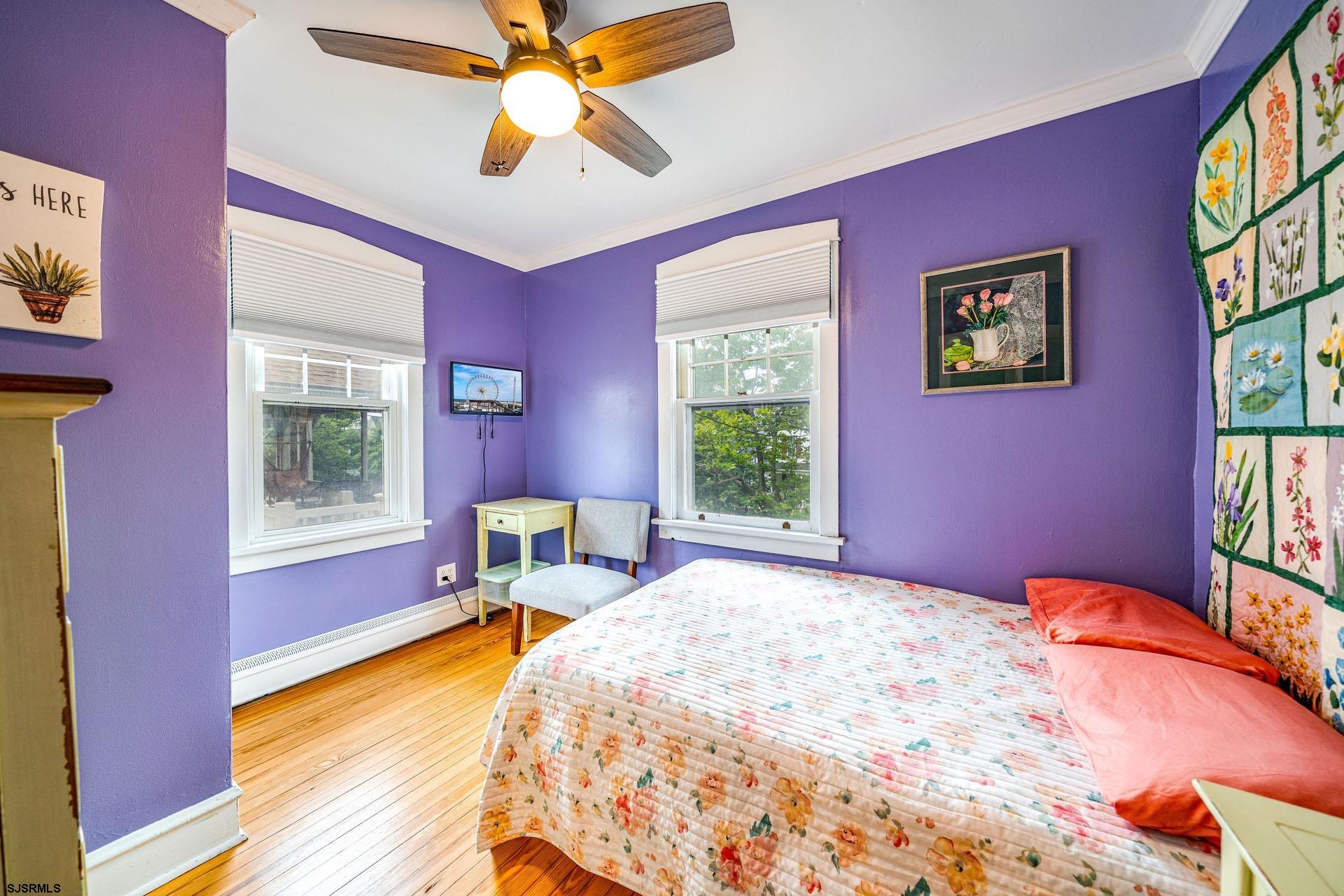 321 Central Avenue Ocean City, NJ 08226 - Photo 17 of 61 a bedroom with a bed and a window