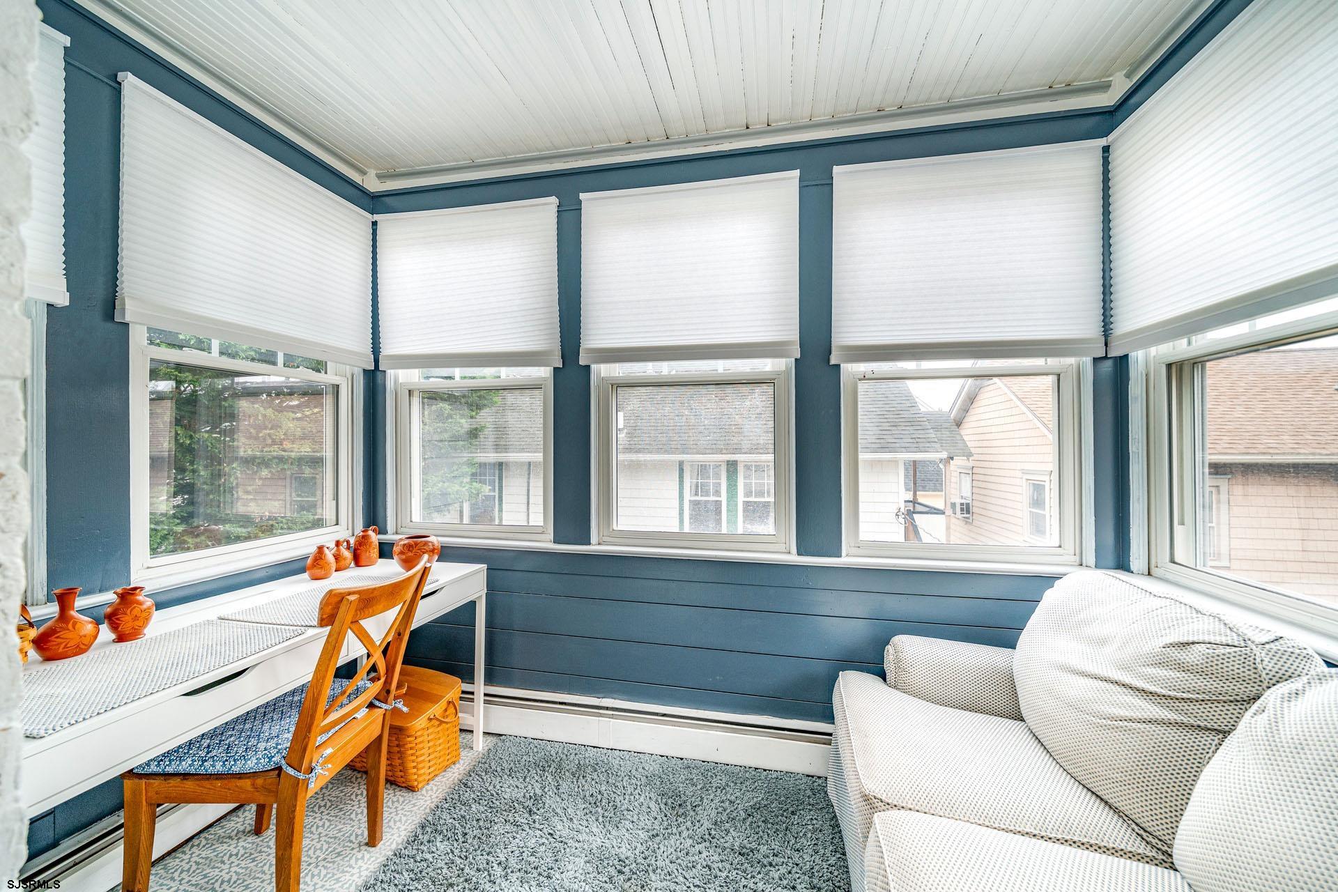 321 Central Avenue Ocean City, NJ 08226 - Photo 29 of 61 a living room with furniture and a large window