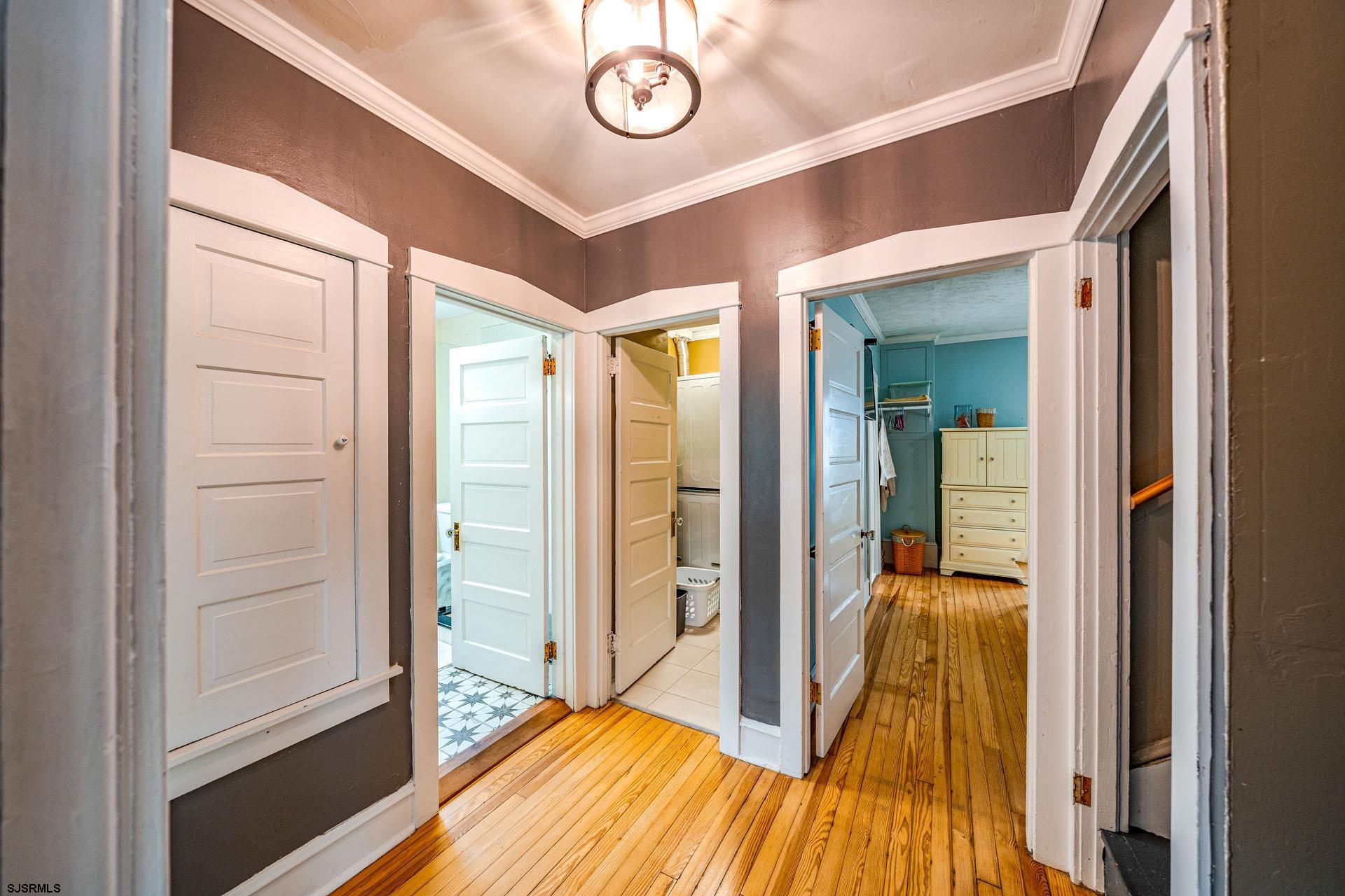 321 Central Avenue Ocean City, NJ 08226 - Photo 30 of 61 a view of a hallway with wooden floor and door