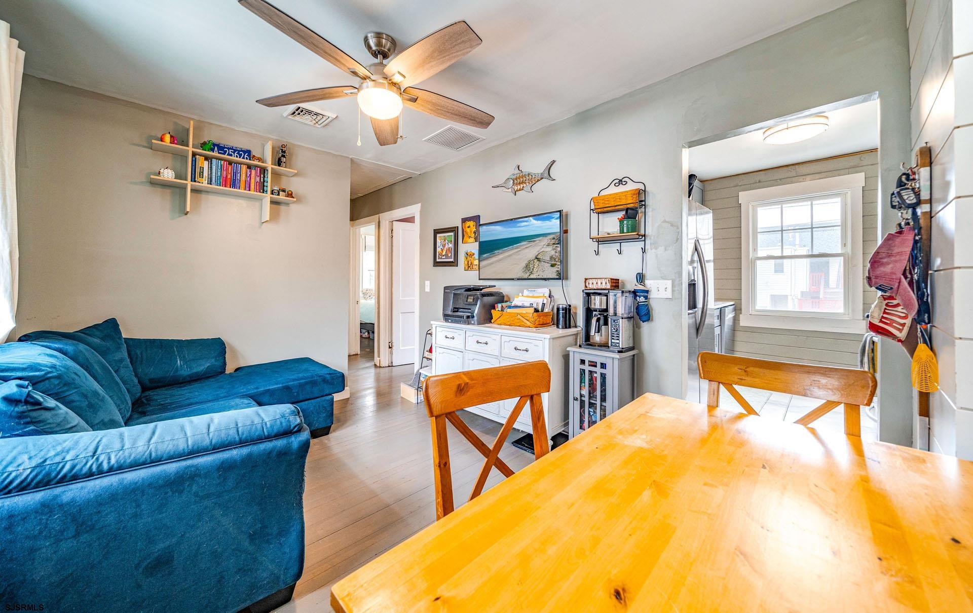 321 Central Avenue Ocean City, NJ 08226 - Photo 37 of 61 a living room with furniture and a flat screen tv