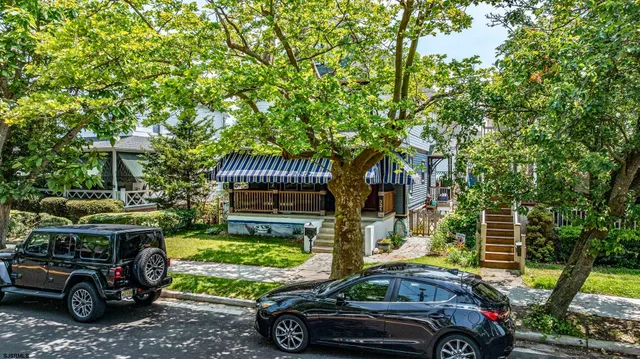 a front view of a house with parking yard
