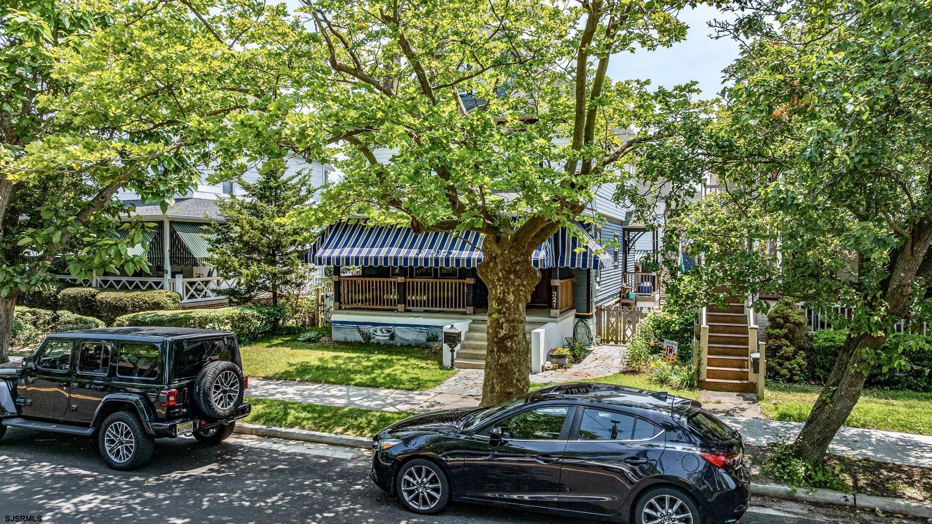 321 Central Avenue Ocean City, NJ 08226 - Photo 5 of 61 a front view of a house with parking yard