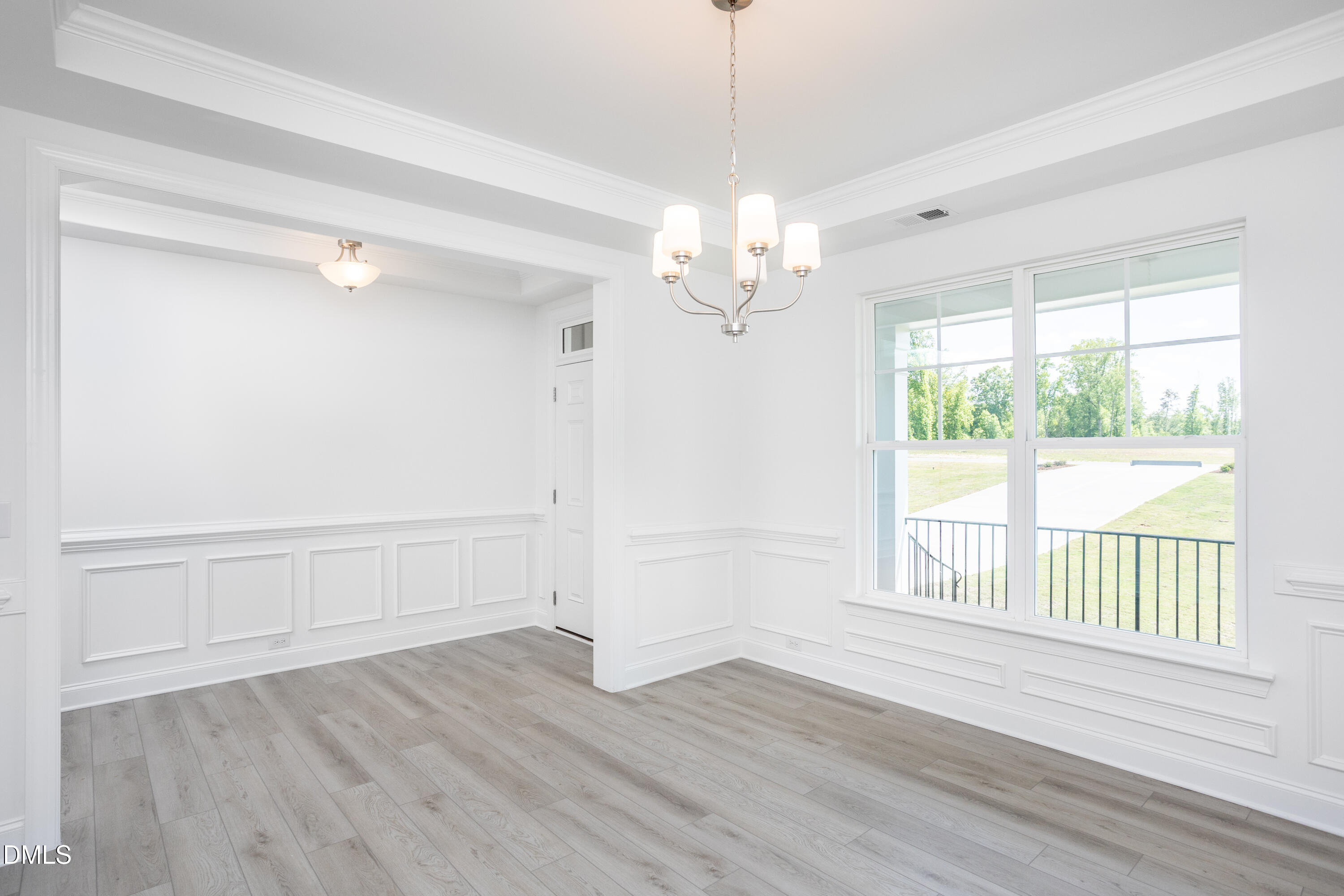 216 Cedar Rdg Trail Angier, NC 27501 - Photo 4 of 33 a view of empty room with wooden floor and fan