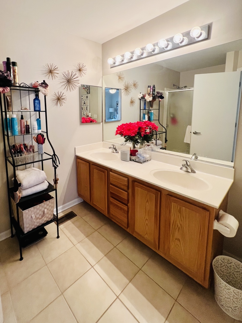 39102 Welsh Lane Beach Park, IL 60083 - Photo 20 of 24 a bathroom with a sink vanity and mirror