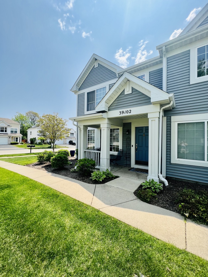 39102 Welsh Lane Beach Park, IL 60083 - Photo 2 of 24 a front view of a house with yard and green space