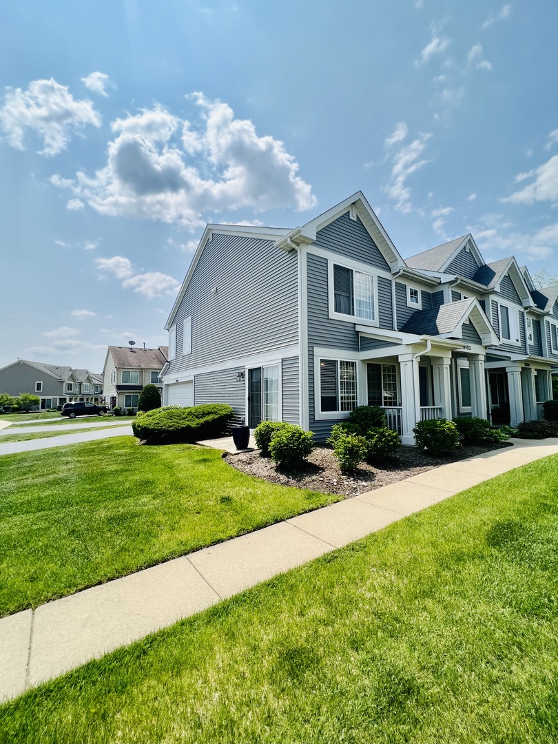 39102 Welsh Lane Beach Park, IL 60083 - Photo 24 of 24 a front view of a house with a yard and garage