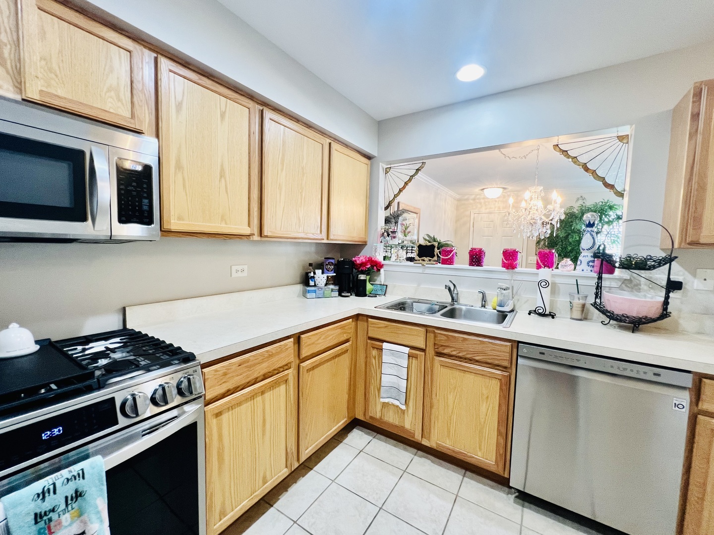 39102 Welsh Lane Beach Park, IL 60083 - Photo 7 of 24 a kitchen with stainless steel appliances granite countertop a sink and a stove