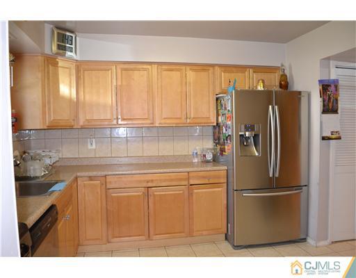 5302 Hana Road Edison, NJ 08817 - Photo 3 of 11 a kitchen with stainless steel appliances granite countertop a refrigerator and a sink