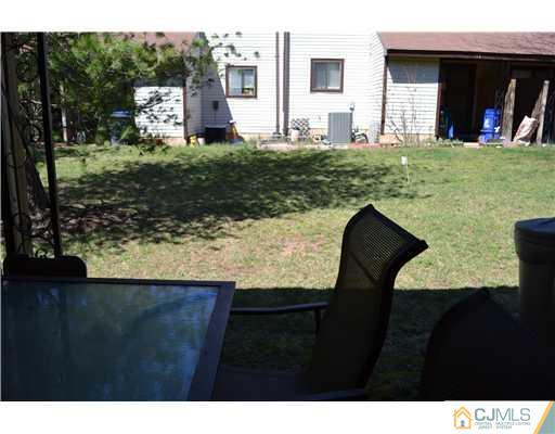5302 Hana Road Edison, NJ 08817 - Photo 7 of 11 a backyard of a house with barbeque oven and outdoor seating