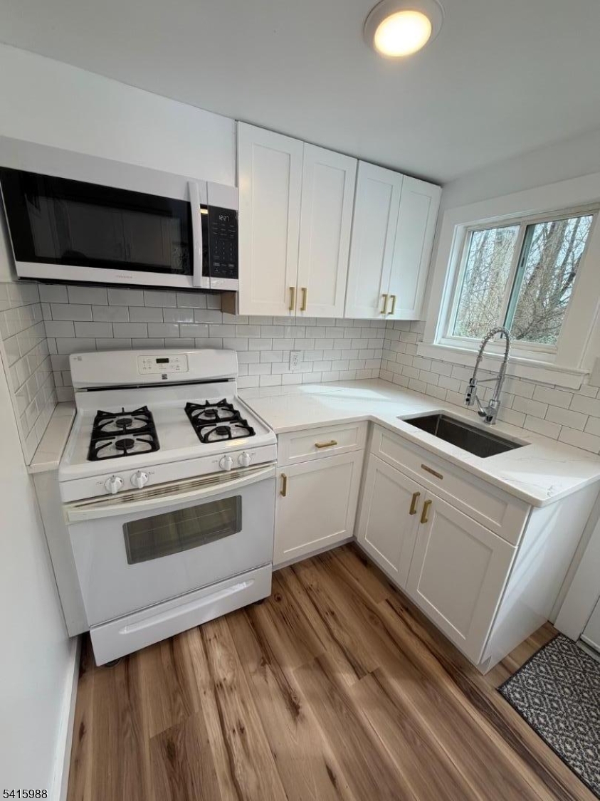 638 Spring Valley Road, Unit 1 Morristown, NJ 07960 - Photo 3 of 11 a kitchen with a stove and a sink