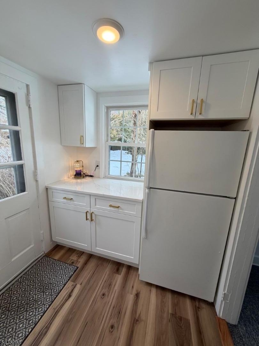 638 Spring Valley Road, Unit 1 Morristown, NJ 07960 - Photo 4 of 11 a kitchen with white cabinets and white appliances